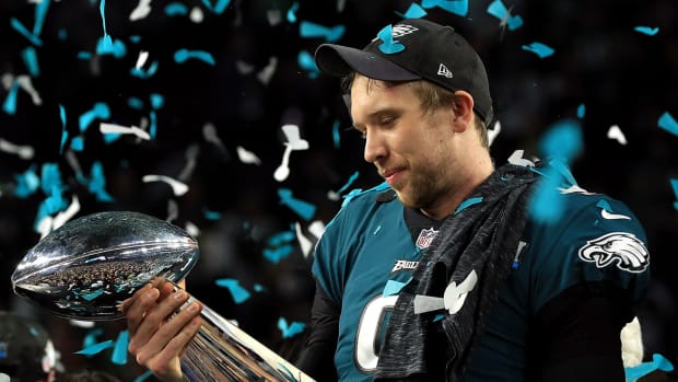 nick_foles_holding_trophy_lovingly.jpg